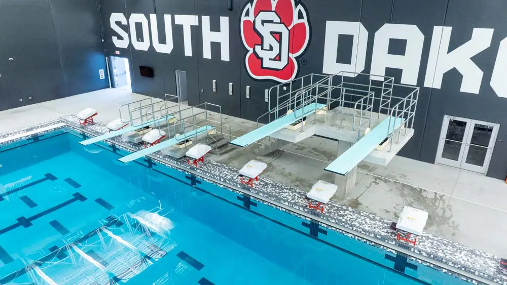 empty pool with diving boards in view