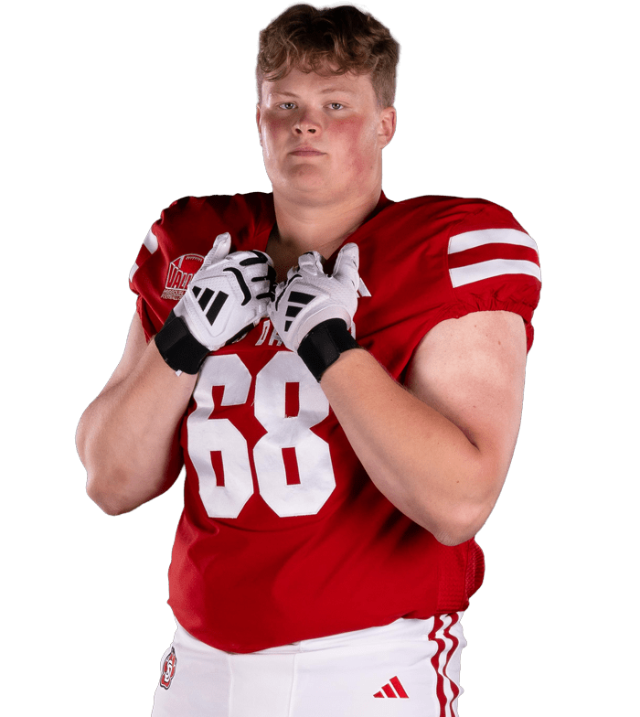 football player posing in pads
