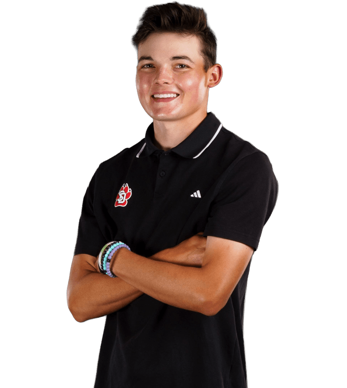Golfer posing with arms crossed
