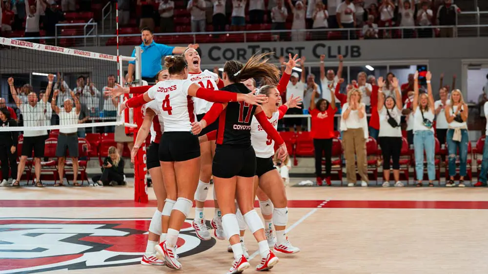 Volleyball players celebrating