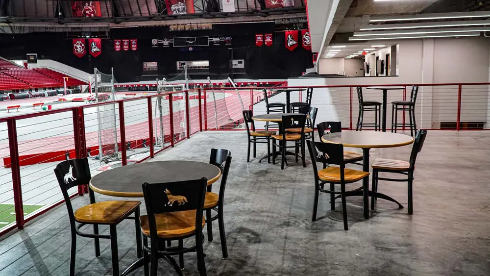 View of track behind empty tables and chairs